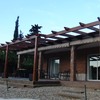 Pérgola de madera con toldo corredero