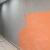 Revoque sobre pared pintada